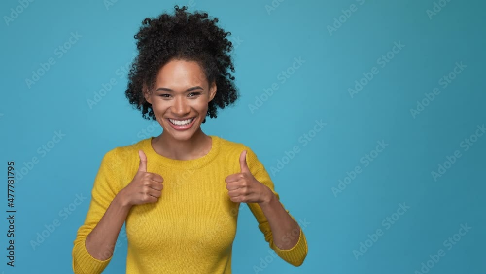 Lady point empty space feedback thumb up sign isolated blue color background Lady point empty space feedback thumb up sign isolated blue color background