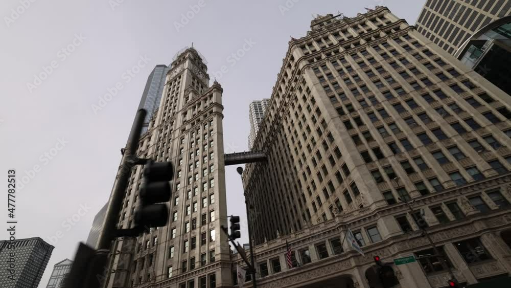 Low Angle View Driving By Wrigley Building In Chicago Low Angle View Driving By Wrigley Building In Chicago