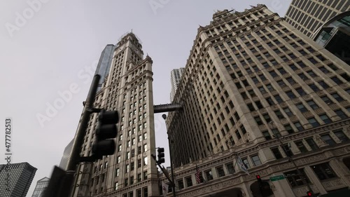 Low Angle View Driving By Wrigley Building In Chicago photo