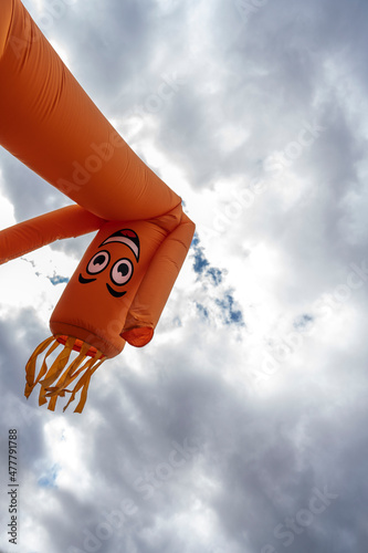 orange inflatable arm flailing tube man