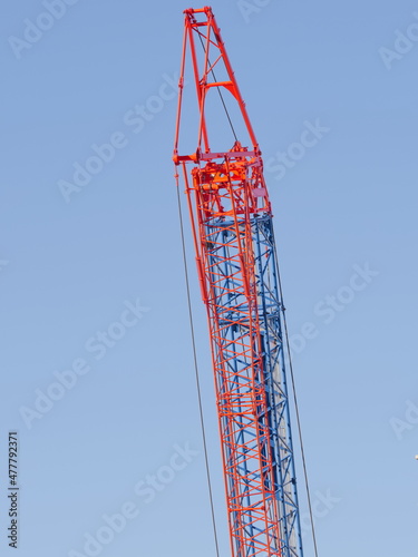 Tokyo,Japan - December 30, 2021: Crawler Crane or Luffing Jib Crawler Crane on blue sky background 