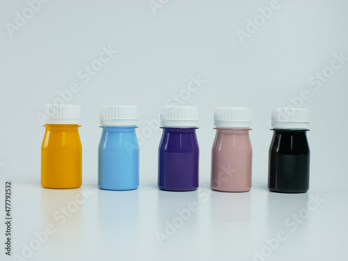 pigment resin paint in the bottle, many colors there are purple, pink, blue, orange, and black.