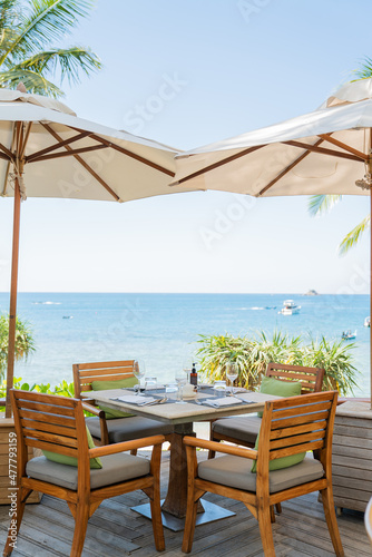 deck chair on the sea  table and chairs on the beach