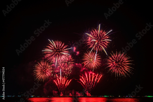 Colorful fireworks of various colors at night with celebration and anniversary concept