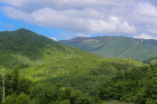 The view of mountains with green forest near Kenh Ha Lake, Nha Trang City