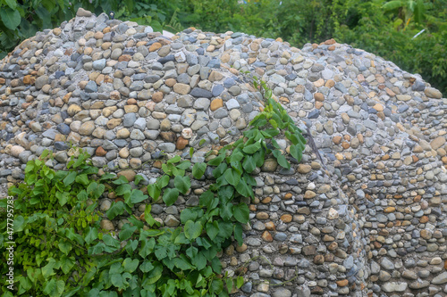 The roof is built of large pebbles photo