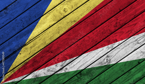 Seychelles flag on wooden background. 3D image