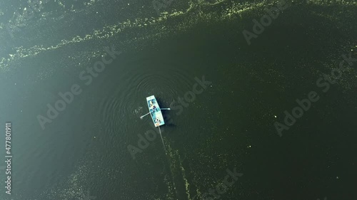 Aerial view of fishermen in a small boat at the confluence of rivers Bhima and Indrayani at Tulapur near Pune India. photo