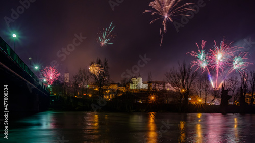 silvester fireworks over enns  upper austria  seen from ennsdorf with the river enns
