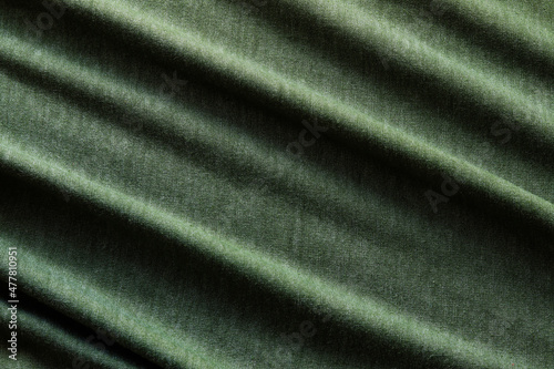 Elegant green silk, luxurious fabric texture, elegant background design.