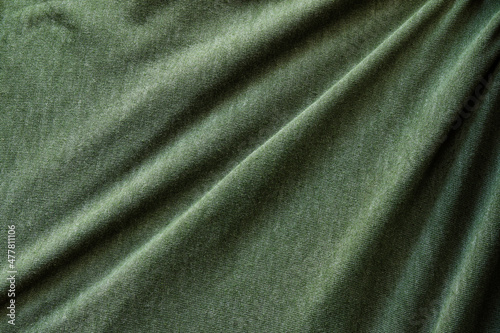 Elegant green silk, luxurious fabric texture, elegant background design.