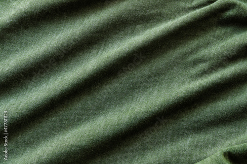 Elegant green silk, luxurious fabric texture, elegant background design.