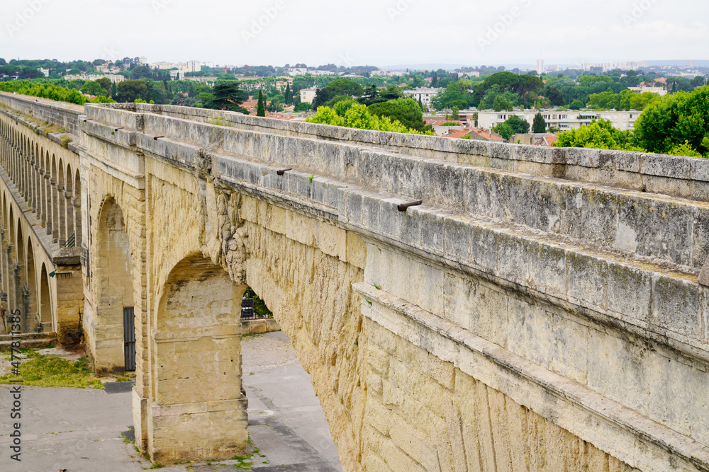 Aqueduct in Royale de Peyro Square Saint Clement building ancient arch in Montpellier