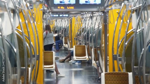 Interior Of A Half-Empty Subway Train With Connected Cars photo