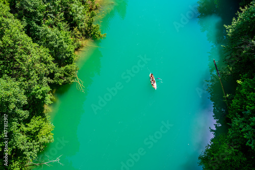 Kayaking on river in forest - beautiful nature scenery