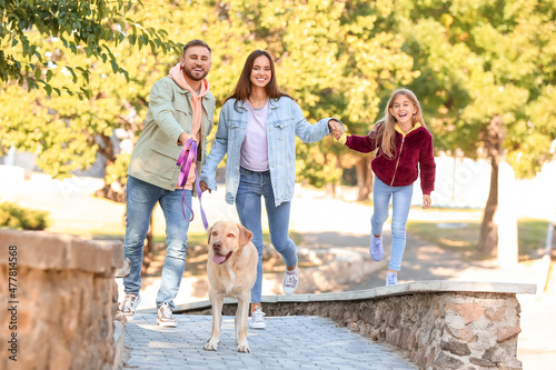 Happy family with Labrador ...