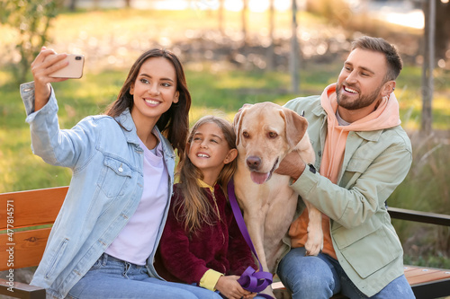 Happy family with Labrador ...