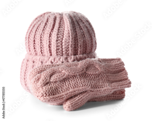 Knitted hat and mittens on white background