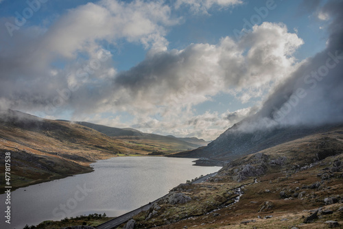 Epic early Autumn Fall landscape of view along Ogwen Valley in Snowdonia National Park under dramatic evening sky with copy space