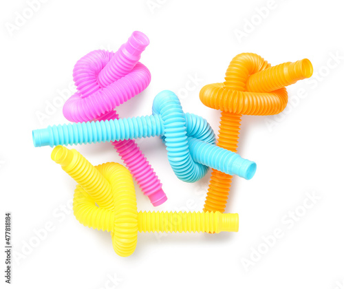 Different colorful Pop Tubes on white background