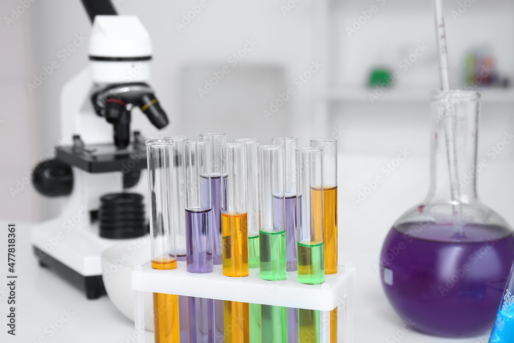 Glassware with samples on table in medical laboratory, closeup Glassware with samples on table in medical laboratory, closeup