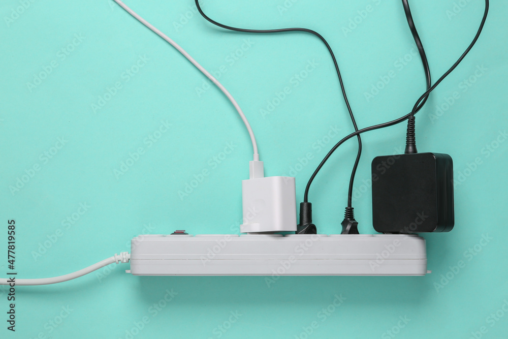 Electrical Extension cord with different plugs and adapters. Top view Electrical Extension cord with different plugs and adapters. Top view