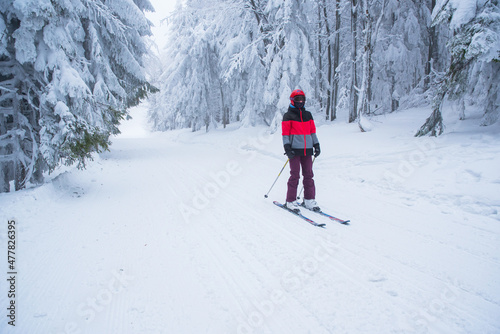 Skier ride in beautiful white snowy nature