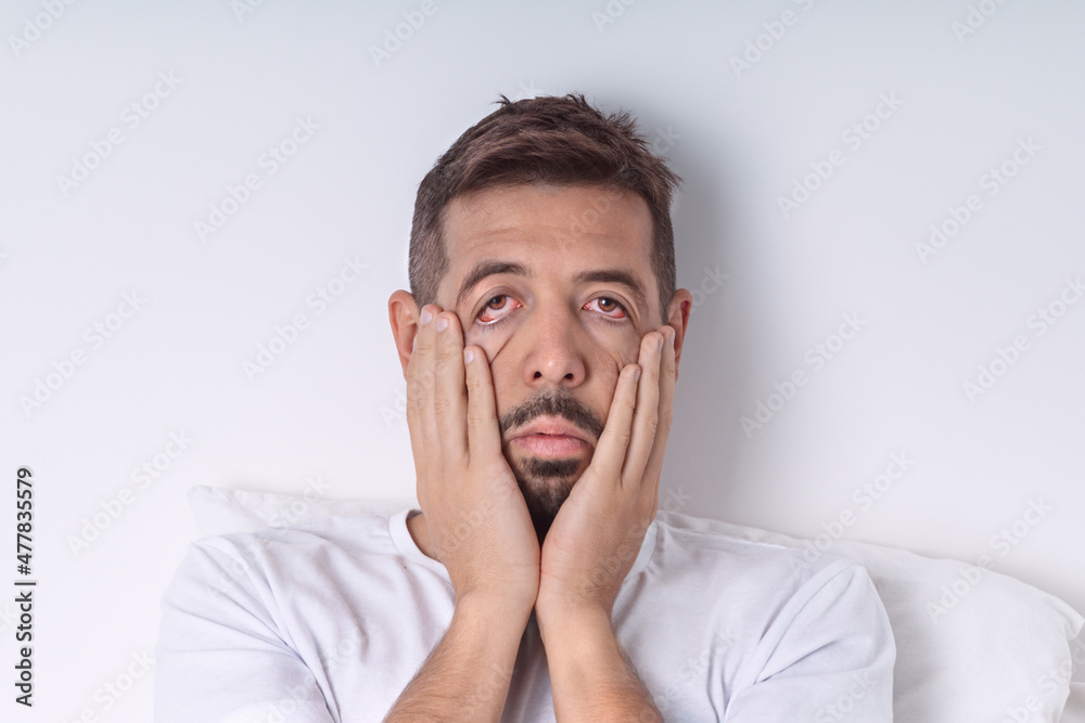 Tired sleepy man with chronic fatigue in the morning. Monday morning. Bad mood and bad morning. Tired sleepy man with chronic fatigue in the morning. Monday morning. Bad mood and bad morning.