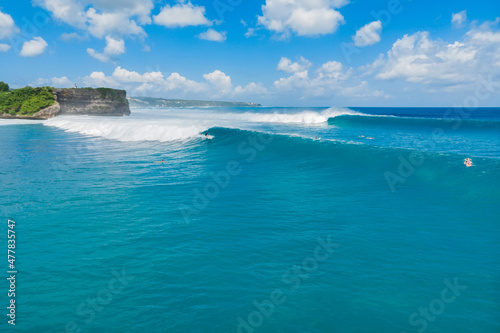 Aerial view of big blue waves for surfing. Perfect ocean waves