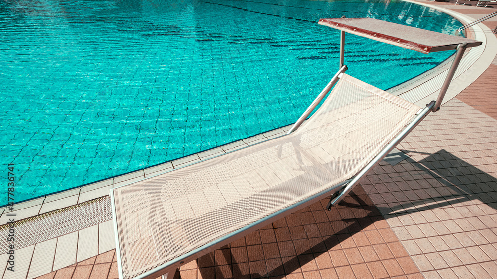 Sunbed. Summer resort chair, relax lounge at luxury hotel pool. Beach lounger chaise. Vacation sea rest sun tan concept.
