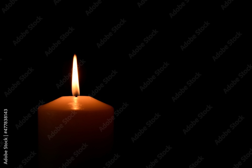 burning candles close-up on black background burning candles close-up on black background