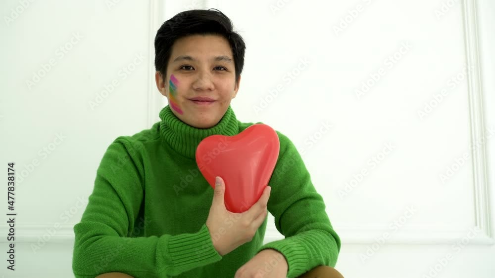 Asian tomboy gay lesbian LGBTQ receiving heart love from partner concept relationship Asian tomboy gay lesbian LGBTQ receiving heart love from partner concept relationship