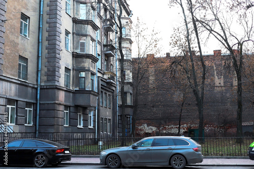 old buildings in a big European city are hung with wires and modern details