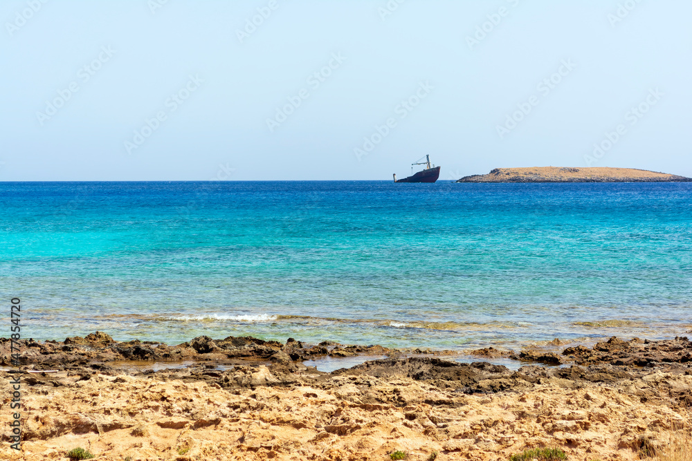 Diakofti port at the Greek island of Kythira. The shipwreck of the Russian boat Norland in a distance.