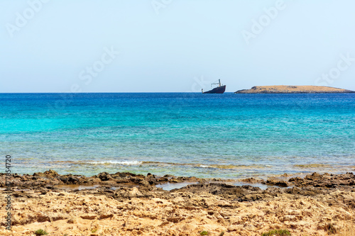 Diakofti port at the Greek island of Kythira. The shipwreck of the Russian boat Norland in a distance.