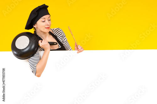 Woman cook in black apron. ...