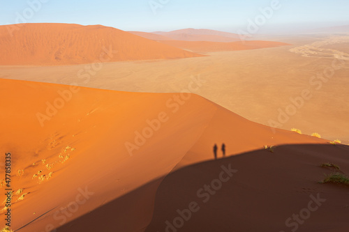 Desert landscape with shadows of people, view of the dunes of Sossusvlei, Namibia