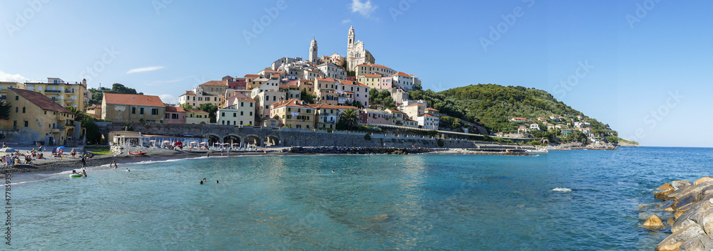 Extra wide panorama of the beach of Cervo with his beautiful historic center in background