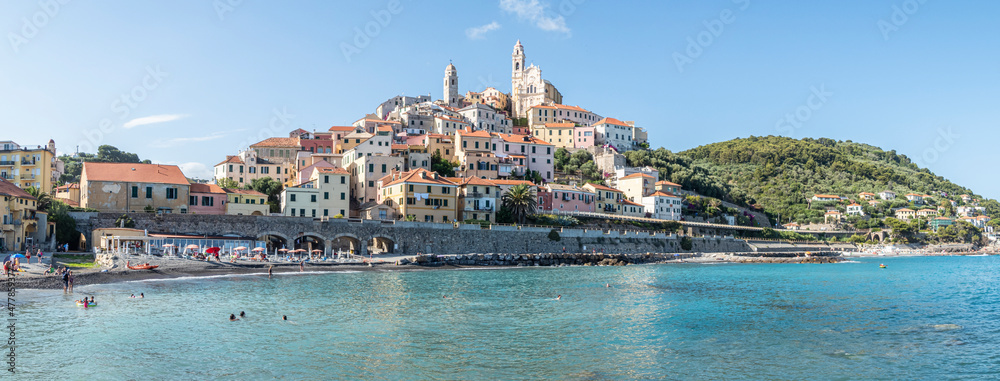 Extra wide panorama of the beach of Cervo with his beautiful historic center in background
