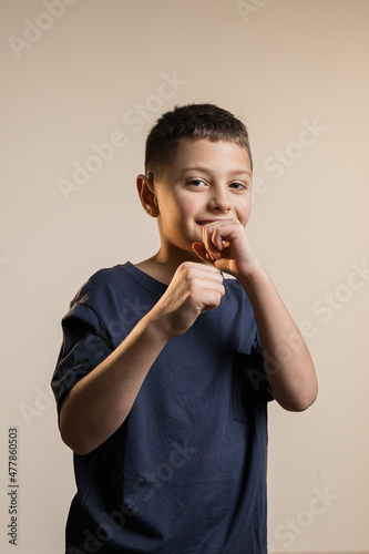 boy standing with fists