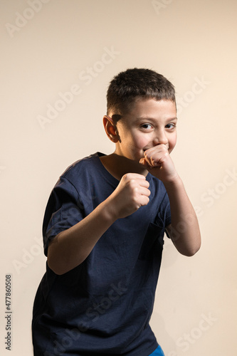boy standing with fists