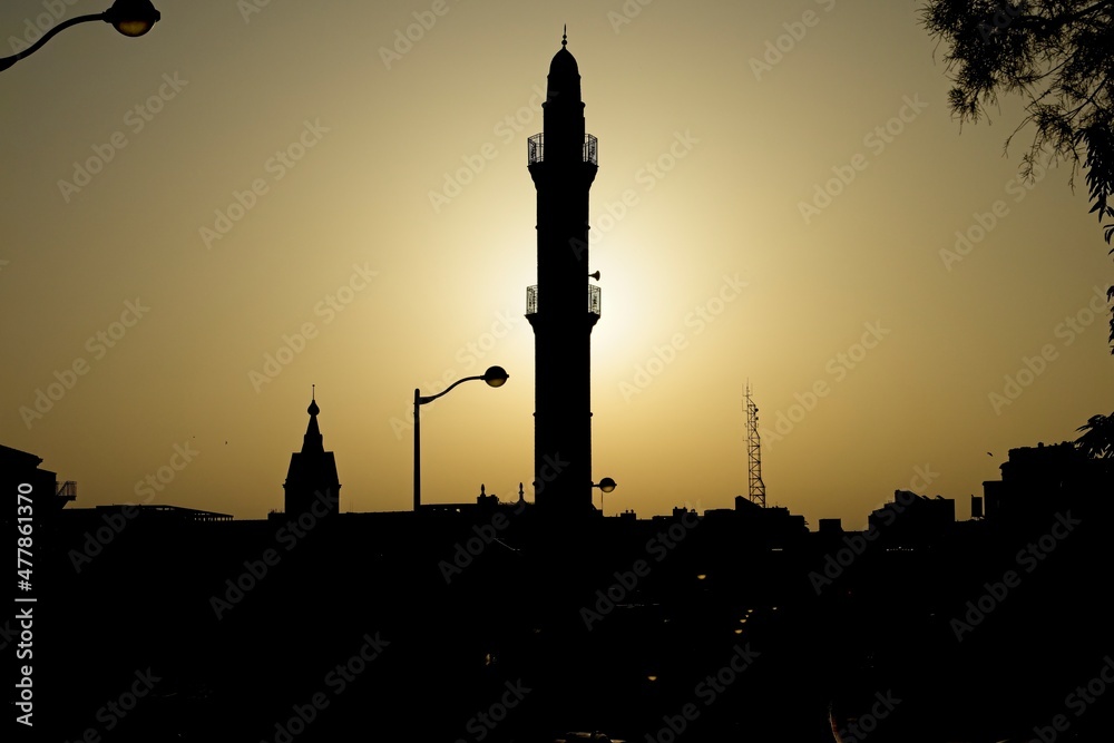 Beautiful and dramatic silhouette of a Mosque from Jaffa Yafo Tel Aviv during sunrise. High quality photo