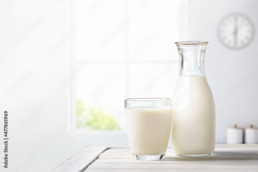 Fresh milk on wooden table in kitchen room. Fresh milk on wooden table in kitchen room.