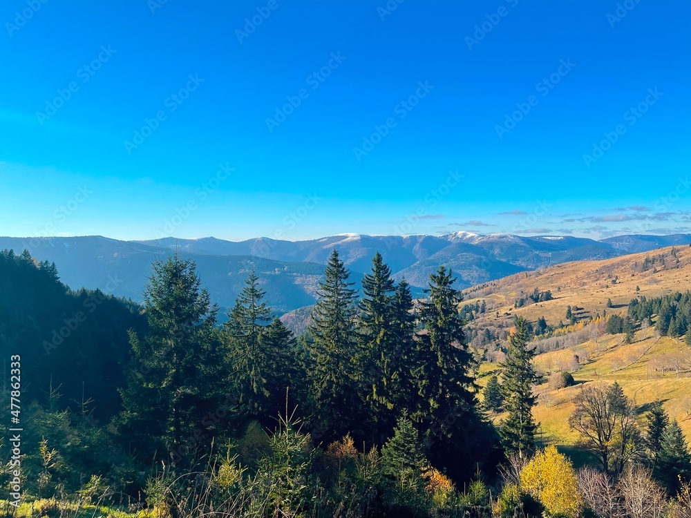 View of the snow-capped Vosges mountains from the Petit Ballon summit on a sunny day