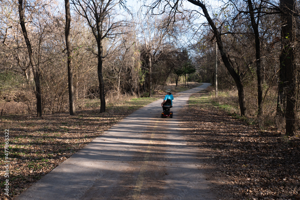 Mobility scooter uses hike and bike trail in Weatherford Texas Mobility scooter uses hike and bike trail in Weatherford Texas