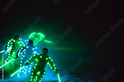 skier with a glowing light suit at the ski show