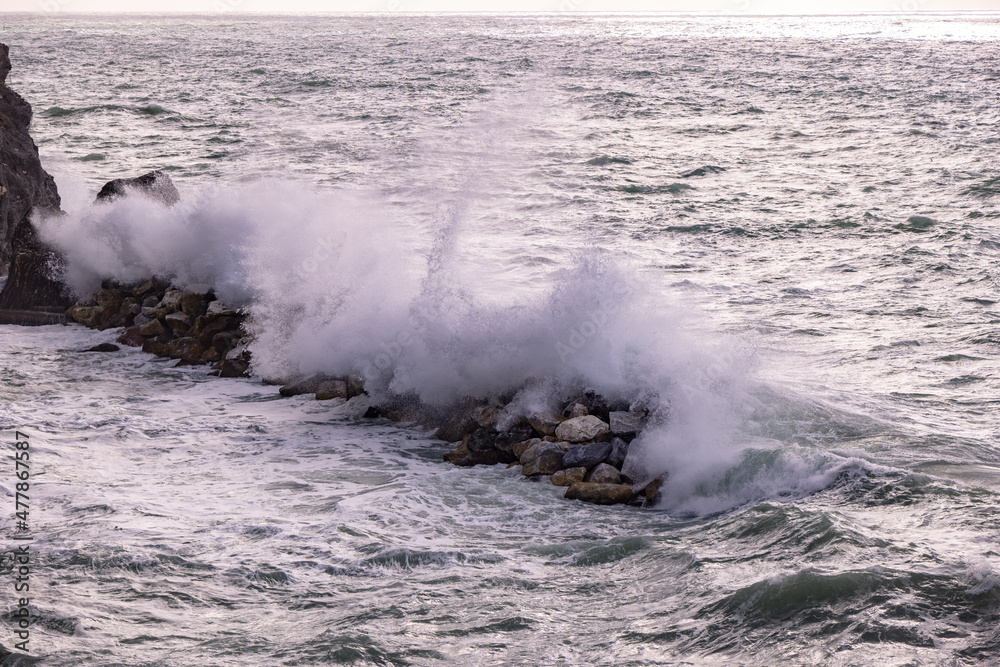 Strong waves hit against the coast of Cinque Terre in Italy - travel photography