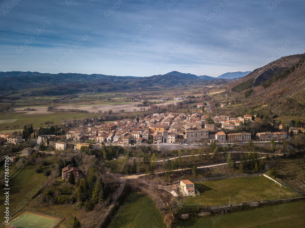 aerial view of the medieval village of Costacciaro at the foot of Montecucco in the province of Perugia region of Umbria Italy