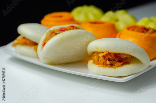 BBQ Jackfruit Bao Buns, Steam cooked seasoned jackfruit and vegetables, coated in a barbecue-style sauce and wrapped in a dough bun