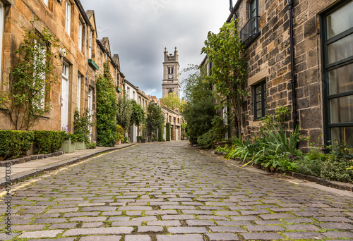 The beautiful picturesque cobbled street of Circus Lane, only a couple of minutes walk away from Edinburgh City center, Scotland photo